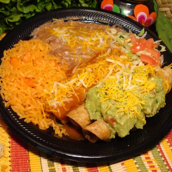 A Los Portales Taco Shop combo plate with rice, beans, enchiladas, taquitos, guacamole, and salad.